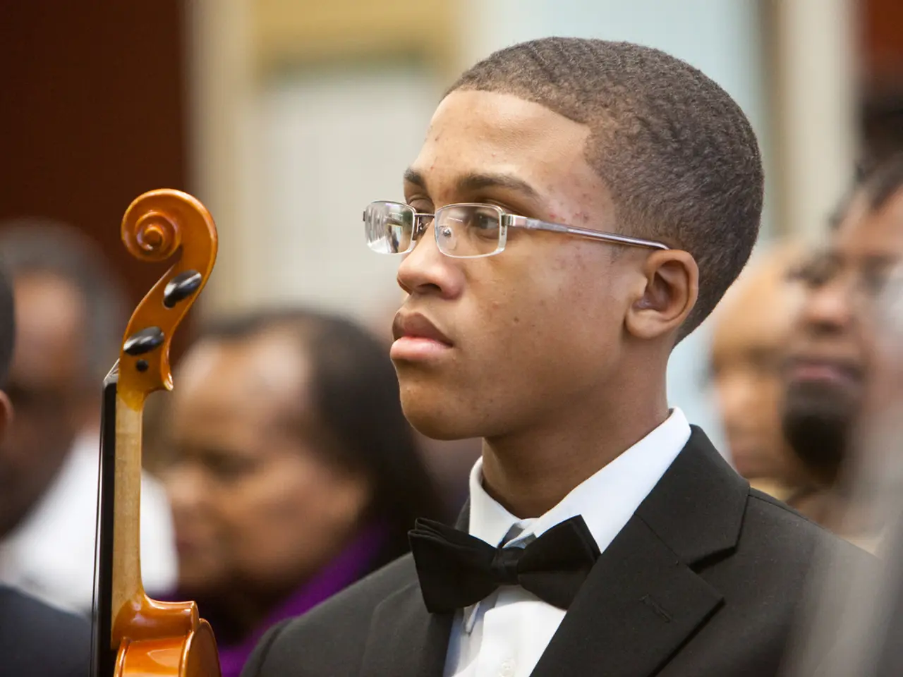 Father conductor puts son at podium, displaying exceptional baton dexterity
