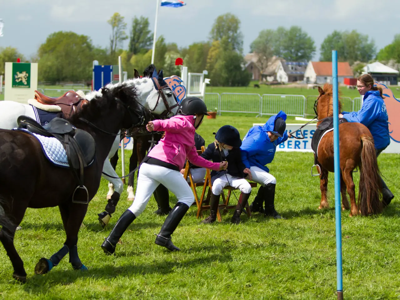There are three horses. These are three kids sitting on the chairs. One person is running and the...