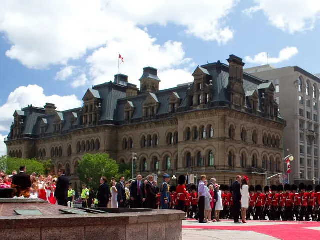 Malay citizens enthusiastically greet their monarch's arrival in a Proton Satria Neo R3, coinciding...
